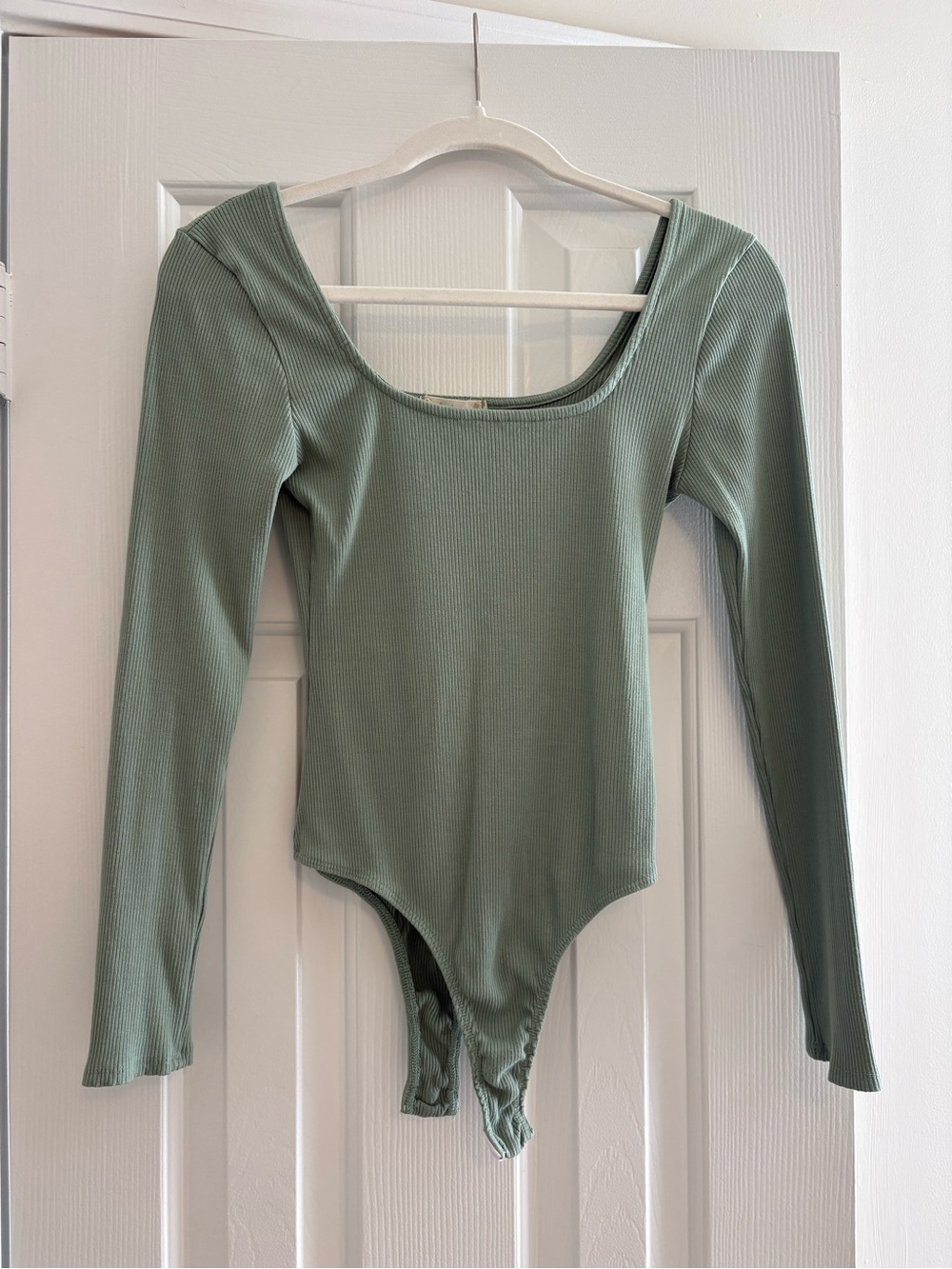Altar’d State Ribbed Long-Sleeve One-Piece Bodysuit in Sage Green